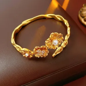 Vintage gold-plated floral cuff bracelet with pearls and sparkling zircon details