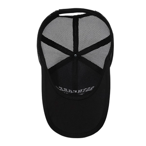 Black breathable mesh trucker hat with wide brim and curved visor in a top view