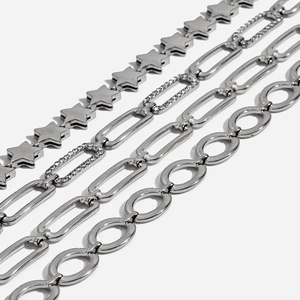 Macro detail of silver stainless steel paperclip chain bracelets with shiny rhinestones