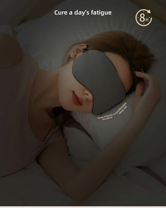Detail of dark grey breathable eye mask showing ergonomic fit and total light blocking