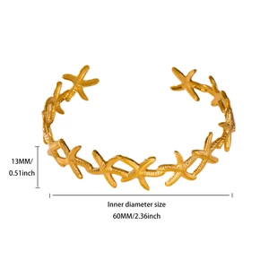 Detailed view of golden starfish cuff bracelet showing 60mm inner diameter and 13mm width
