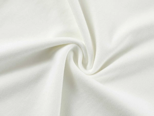Macro shot of white modal fabric showing the soft knitted texture and fine ribbed details