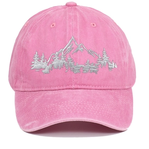 Detailed close-up of pink washed cotton baseball cap featuring mountain embroidery