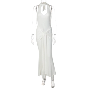 Detail of waist-knot design on a white halter-neck maxi dress with floor-length hem