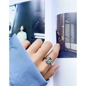 S925 sterling silver ring featuring a large rectangular light blue gemstone and textured band