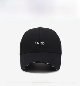 Detailed view of black baseball cap with white FARD embroidery and lettered brim
