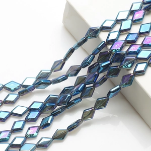 Close-up of iridescent diamond-shaped glass crystal beads for DIY jewelry making
