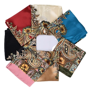 Classic paisley print square silk scarves in multiple colors arranged in a circular layout