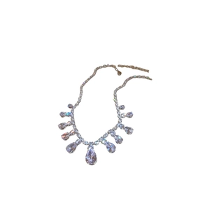 Elegant silver zircon tassel necklace with teardrop crystal pendant on white background