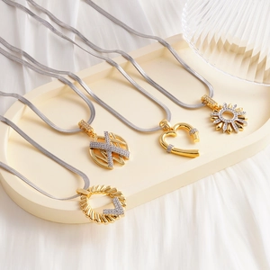 Fashion heart and starburst pendants on silver snake chains with zircon stones