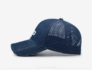 Close-up side view of navy blue mesh baseball cap featuring white side embroidery