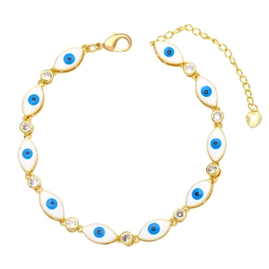 Detailed macro view of gold evil eye bracelet with colorful enamel and zircon charms