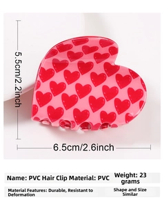 Macro view of light pink PVC heart claw clip with size dimensions 6.5x5.5cm