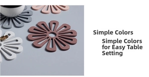 Close-up of flower-shaped silicone heat insulation mats in various minimalist colors