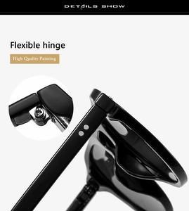Detail view of the flexible hinge and high-quality black frame on round sunglasses