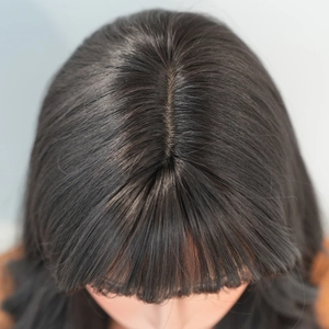 Detailed top view of realistic scalp and hair parting on black long wavy wig