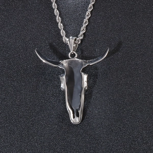 Detailed view of silver stainless steel bull skull pendant with twisted rope chain necklace