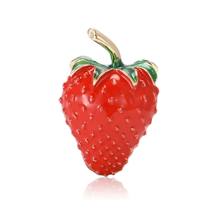 Cartoon red strawberry enamel brooch with gold leaves on a clean white background