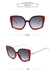 Front and side view of cat eye sunglasses with red and black frame and spiral metal temples