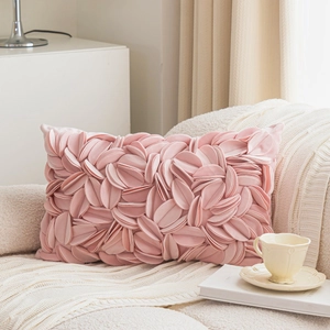 Pink princess style decorative pillow cover with 3D floral petal texture on a sofa