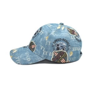 Detail of light blue denim baseball cap featuring vintage Speed Rebels printed graphics