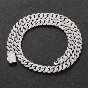 Macro detail of 12mm silver iced out Cuban chain necklace with micro-pave cubic zirconia