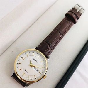 Elegant women's quartz business watch with calendar display and brown leather strap