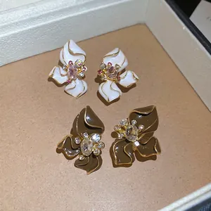 Exquisite flower stud earrings with enamel petals and rhinestones in a luxury jewelry box