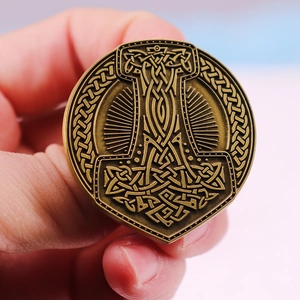 Bronze Viking Mjolnir brooch with intricate Celtic knots and Nordic runes pattern