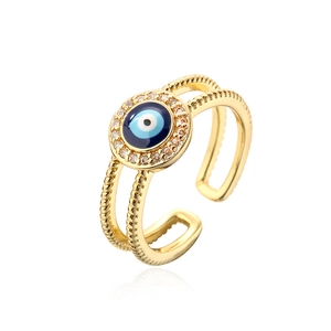 Macro view of 18K gold plated evil eye ring with blue enamel and sparkling zircon stones