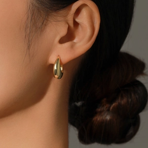 Polished gold teardrop hoop earrings for women in minimalist sterling silver style