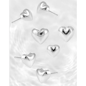 Polished S925 sterling silver heart stud earrings on water ripple background