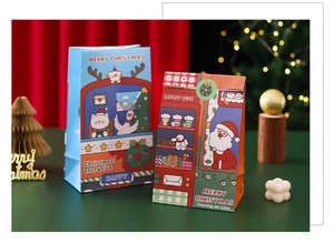 Close-up of blue and red Christmas paper gift bags with Merry Christmas holiday patterns
