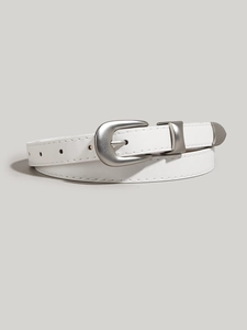 Close-up of white leather belt with a silver alloy buckle laid flat on gray background