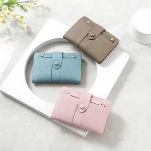 Minimalist short leather wallets for women in sky blue pink and brown with gold buckle