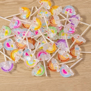 Colorful resin lollipop charms with plastic butterfly accents and metal hanging rings