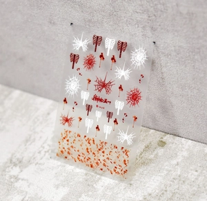 Detail of Halloween nail stickers with spider webs, skull bones and red blood splatters