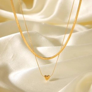 Double-layer 18k gold plated snake chain necklace with heart pendant on white silk