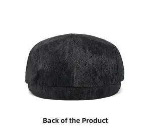 Rear view of black faux suede newsboy cap showing matte texture and stitch detail