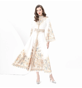 Detail of vintage paisley print on long-sleeved dress with matching belted waist