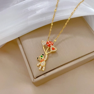 Luxurious gold-plated titanium steel necklace featuring a crystal-paved balloon bear pendant