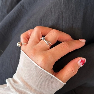 S925 sterling silver knotted and beaded rings shown on fingers for a minimalist look