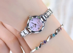 Detail of silver ladies watch with purple gradient dial and matching colorful gemstone bracelet