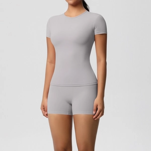 Detailed view of light gray high-elasticity seamless yoga shorts and short sleeve gym set