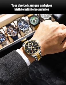 Close-up of CURREN luxury men's chronograph watch with two-tone steel strap on wrist