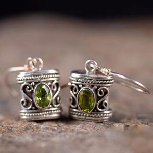 Retro geometric silver earrings with oval green gemstones and bohemian floral carvings