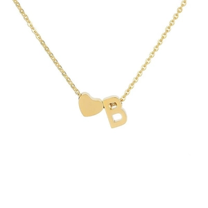 Detailed macro view of 18k gold plated heart pendant and letter B on stainless steel necklace