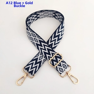 Detail of blue and white wave pattern woven strap with adjustable gold buckle