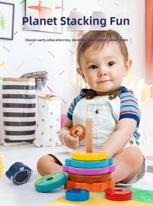 Detailed view of planetary wooden stacking rings on a natural wood base for early learning