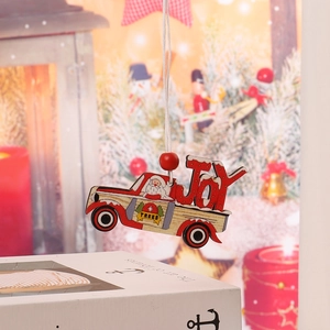 Detail of red wooden Christmas truck ornament with Joy text and Santa Claus painting
